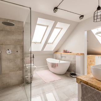 luxurious modern bathroom featuring a freestanding bathtub and glass shower with five skylights illuminating the space